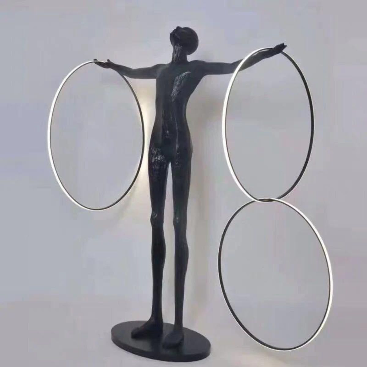 Human Posing with Burning Circle LED Floor Lamp 1