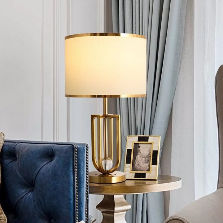 Amanda metal-based modern table lamp beside sofa set in stylish living room
