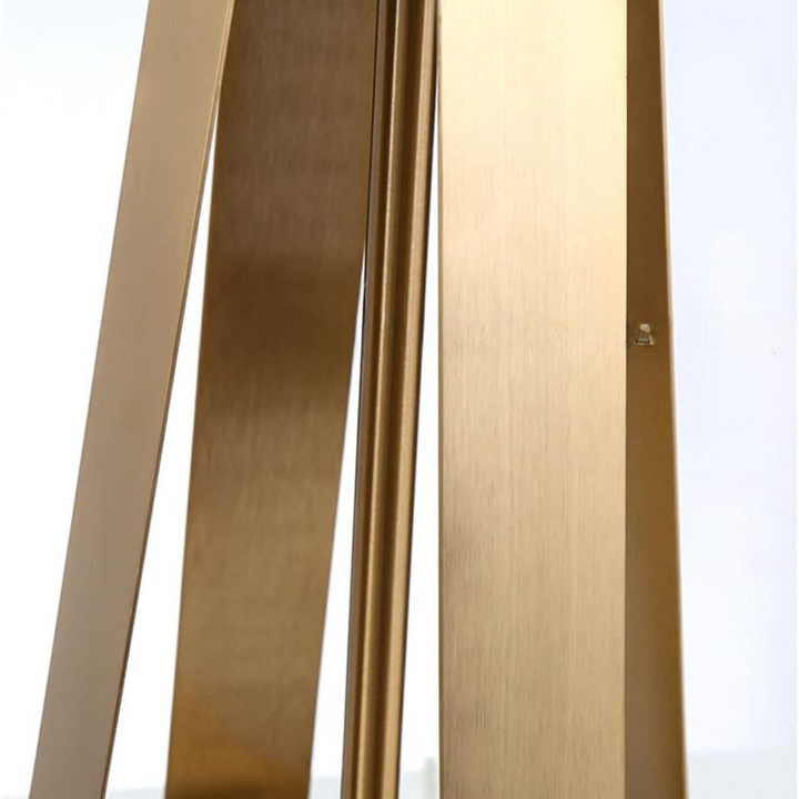 Close-up detail of Aura metal-based bedside table lamp, showcasing sleek modern design and finish