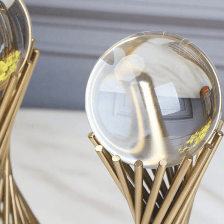 Waist-high shot of beautiful dwarf model holding detailed glass ball