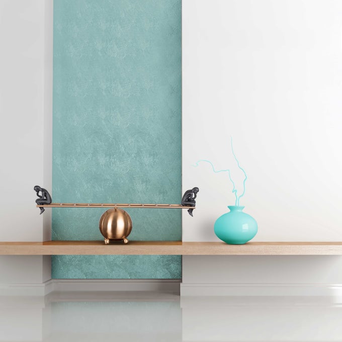 Artistic display of black thinker statues pair on decorative ladder, modern home decor accent.