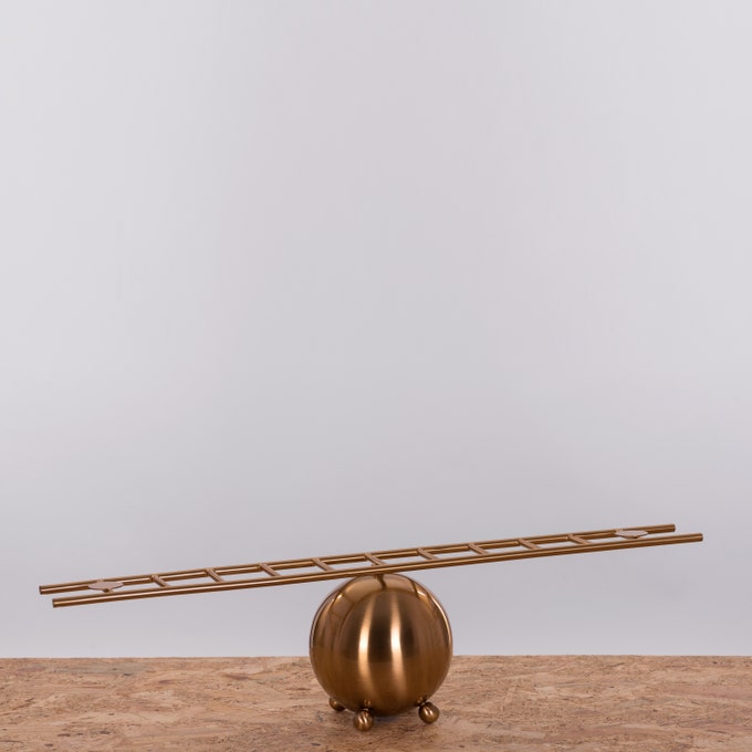 Decorative ladder display without statues, showcasing minimalist modern design