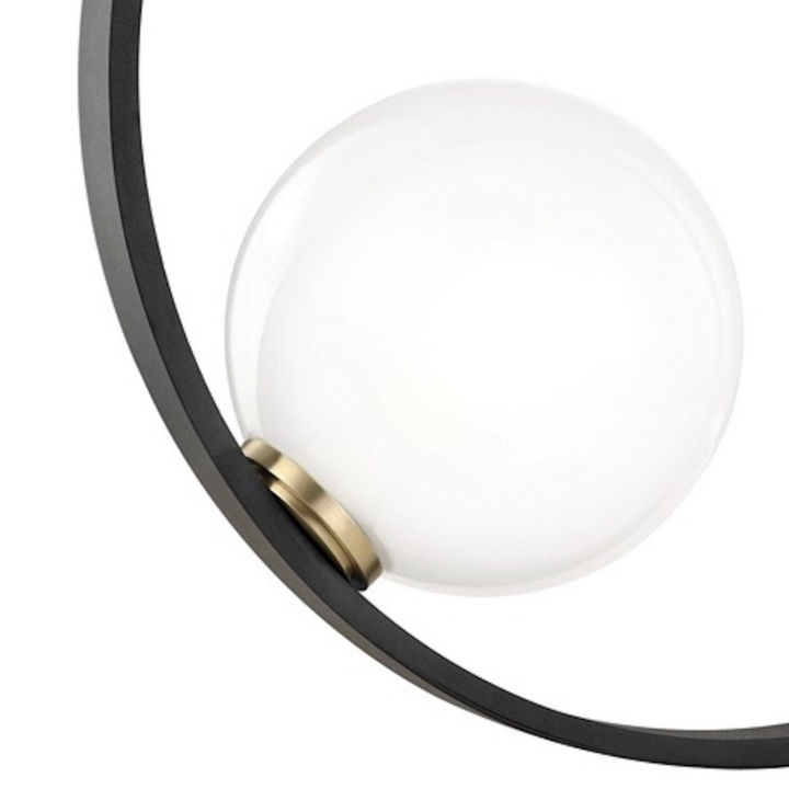 Close-up view of Bozza circle-shaped bedside table lamp bulb, showcasing modern lighting details