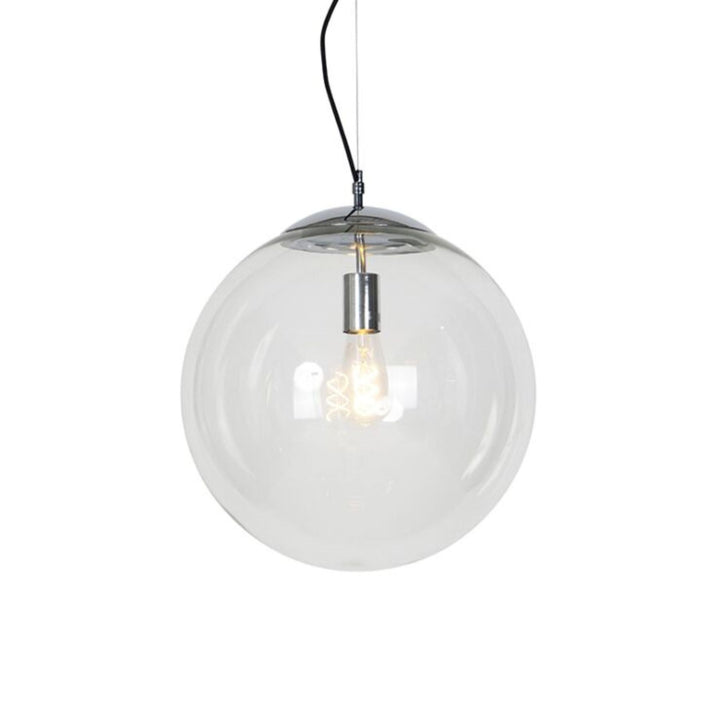 Single light pendant hanging from ceiling, glowing warmly and illuminating a modern interior space