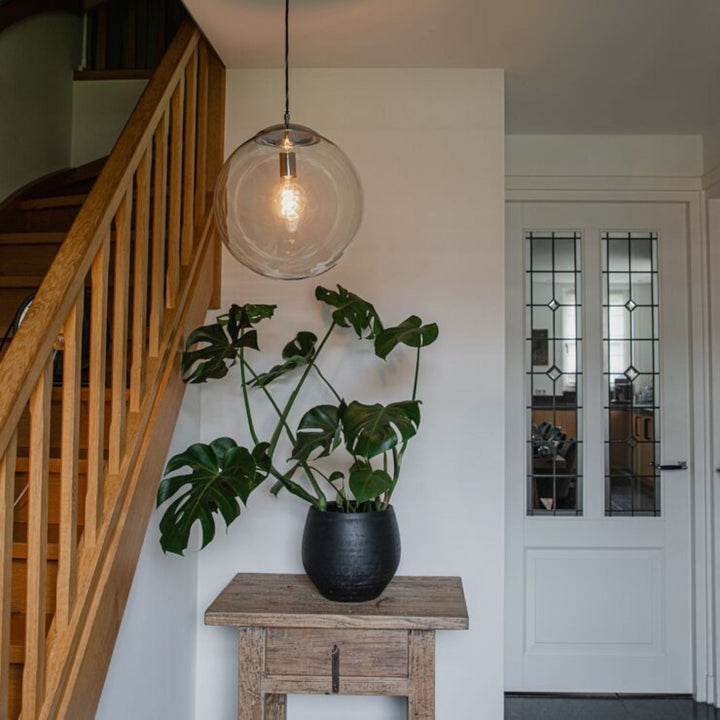 Single light pendant fixture with modern design, perfect for elegant interior lighting