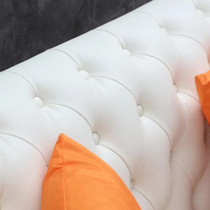 Close-up detail of Chesterfield tufted sofa leather upholstery showing texture and quality