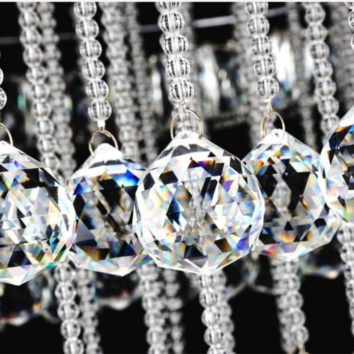 Close-up of crystal details on Clouds chandelier above dining table in elegant Australian interior