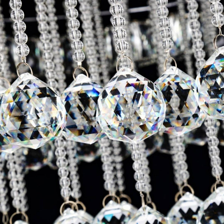 Close-up of crystal details on Clouds chandelier above dining table in elegant Australian interior