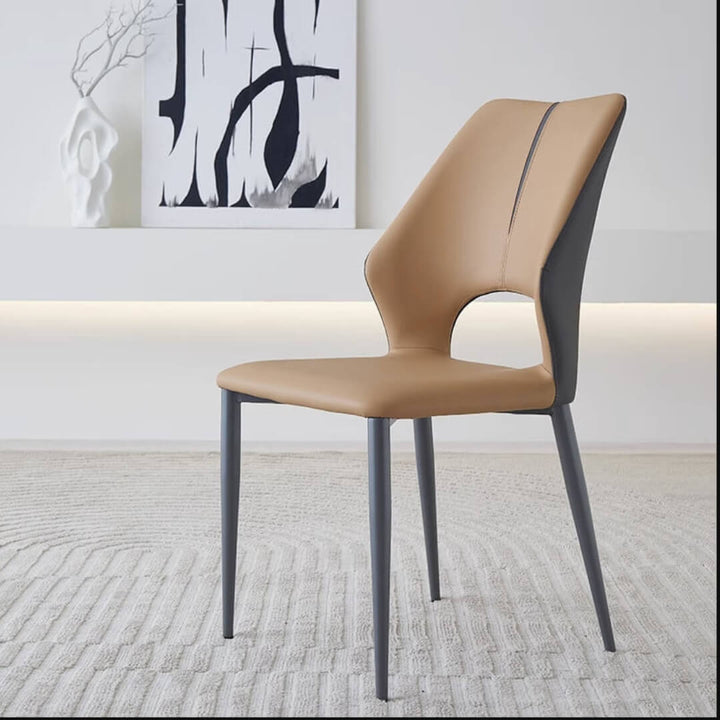 Side angle view of Cora Dining Chair Y70 in an elegant Australian interior – sleek modern design with plush upholstery and curved backrest