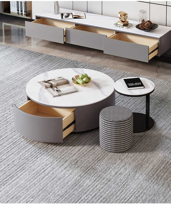 Cozy Nest round nesting coffee table with drawer open, showcasing storage in elegant interior