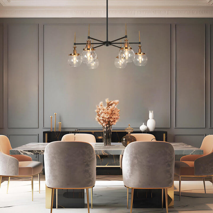 ECLIPSE Loram 6-light chandelier installed in modern living room, featuring sleek circular design and ambient lighting