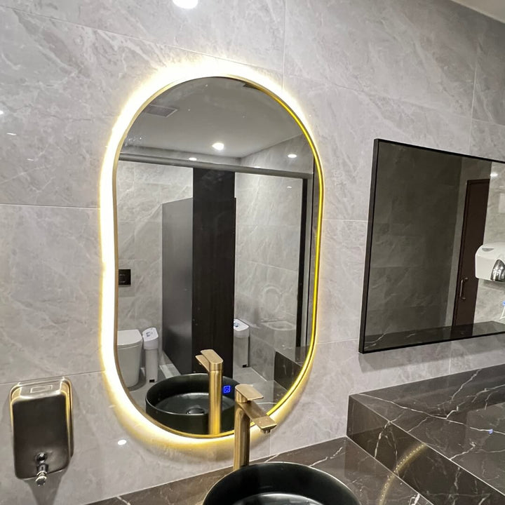 EO-5083 60cm oval LED mirror by Eclipse Home, sleek modern design with bright illumination for bathrooms