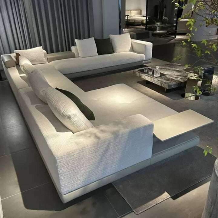 Side view of Eastor sofa in elegant interior – modern design with plush upholstery and sleek silhouette