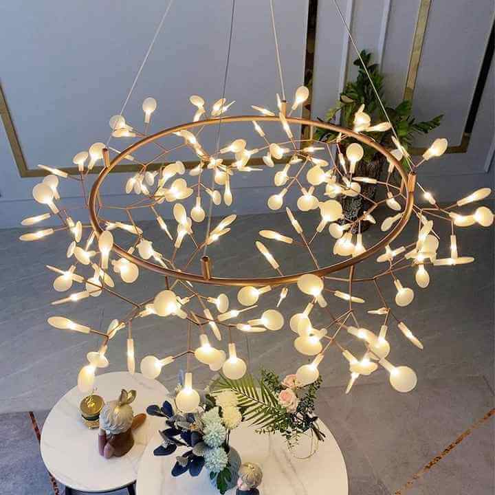 Upper view of Firefly LED chandelier showcasing elegant design and warm lighting in a stylish interior