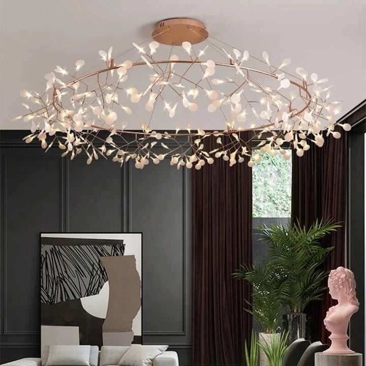 Firefly LED chandelier with elegant design, glowing warmly in a stylish interior setting