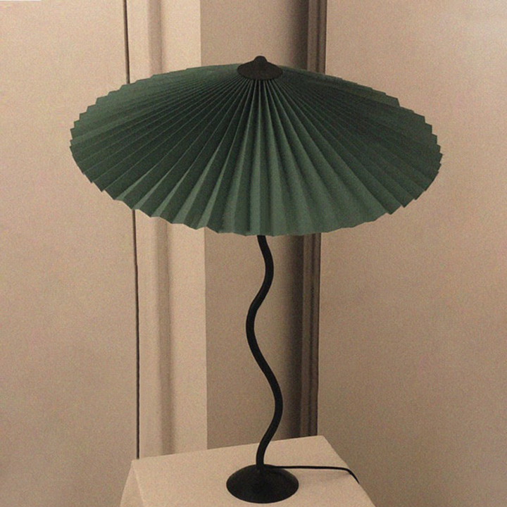 Unique modern table lamp featuring folded fabric shade