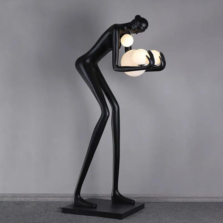 Side view of HTA-005 humanoid man and woman floor lamp in Australian interior with modern sculpture