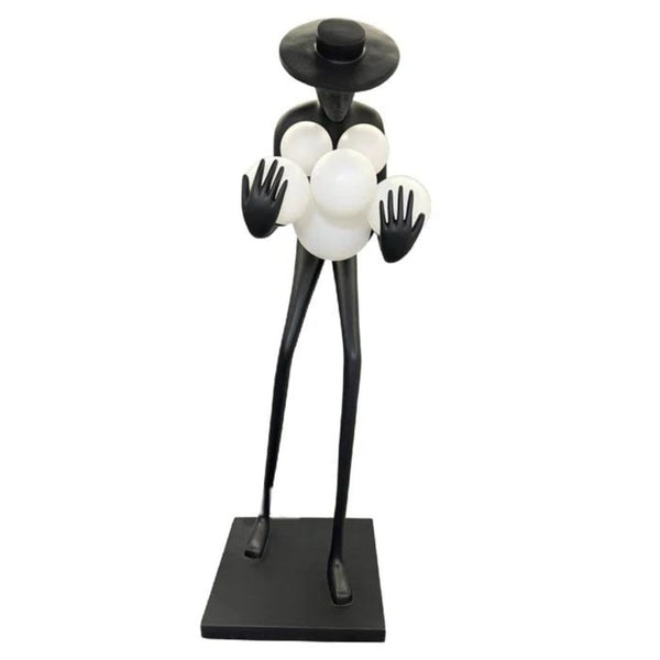 Front view of black human sculpture floor lamp with glowing orbs, combining modern art and lighting