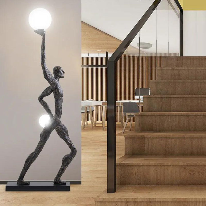 HTA-015 man holding lamp floor lamp placed beside stair in Australian home with modern artistic style