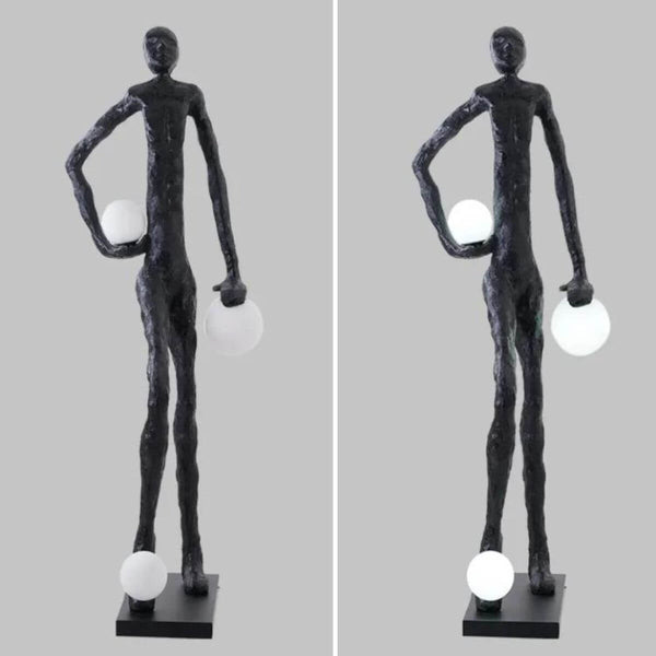 HTA-016 sculptural floor lamp featuring a man holding three lamps, displayed in an Australian interior with artistic design and ambient lighting