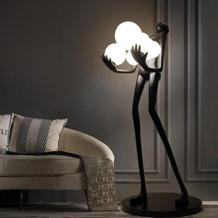 Side view of HTA001 humanoid floor lamp turned on, showcasing sleek design and warm ambient light
