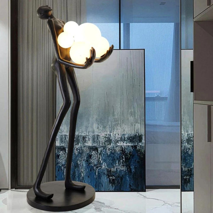 Side view of HTA001 humanoid floor lamp turned on, highlighting modern design and warm lighting