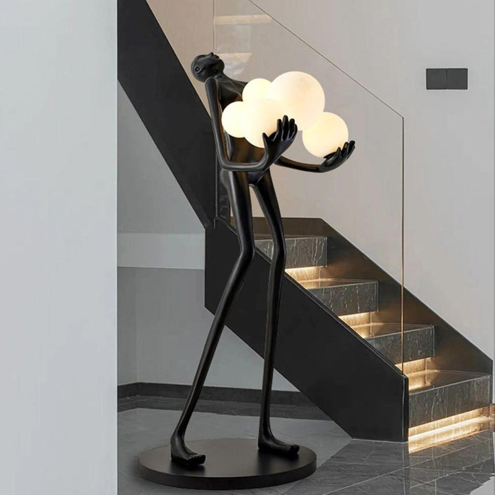 HTA001 humanoid floor lamp turned on beside stair in modern interior, providing warm ambient light