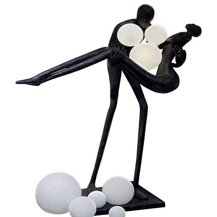 HTA018 sculptural floor lamp showing a man holding a woman, placed in a modern Australian interior, combining artistic expression with soft ambient lighting