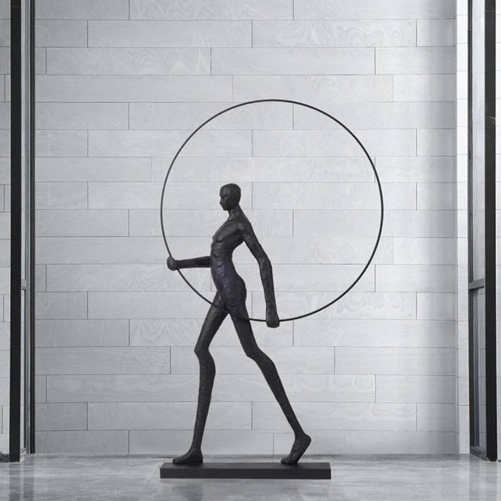 HTA019 man walking with circle floor lamp in modern Australian interior, showcasing artistic lighting