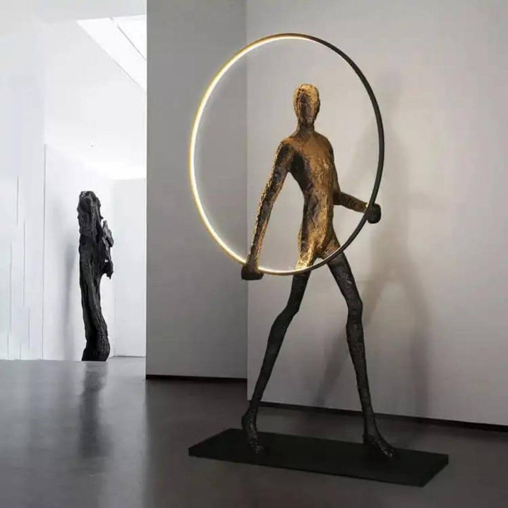 HTA019 man walking with circle floor lamp beside wall in Australian interior with modern design