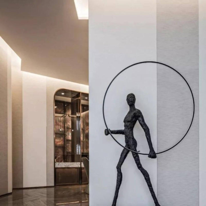 HTA019 man walking with circle floor lamp in Australian interior, showcasing modern lighting design