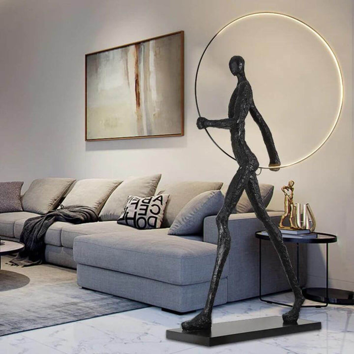HTA019 man walking with circle floor lamp in stylish living room, showcasing modern ambient lighting