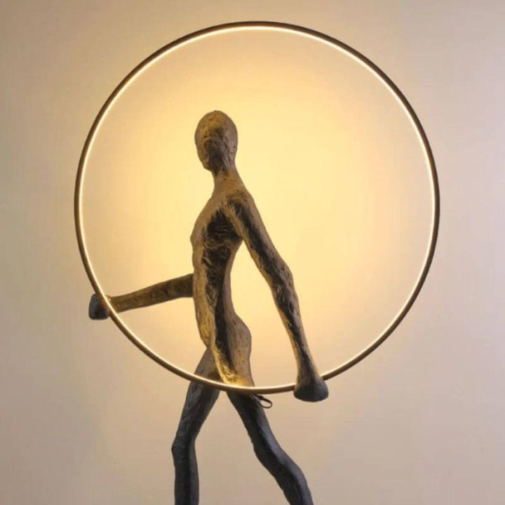 Detail view of HTA019 man walking with circle floor lamp on, highlighting modern lighting design