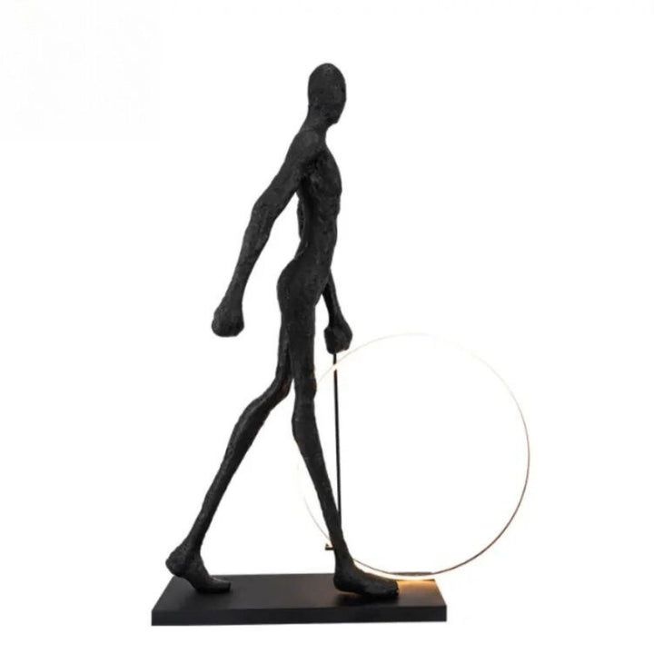 Side view of a man walking beside a circle LED floor lamp, highlighting the lamp’s glowing ring and sleek modern design in a stylish interior