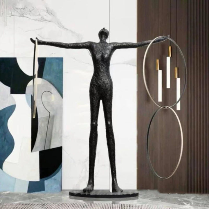 Human posing beside burning circle LED floor lamp near a side door, highlighting warm ambient lighting and modern minimalist design in a contemporary interior