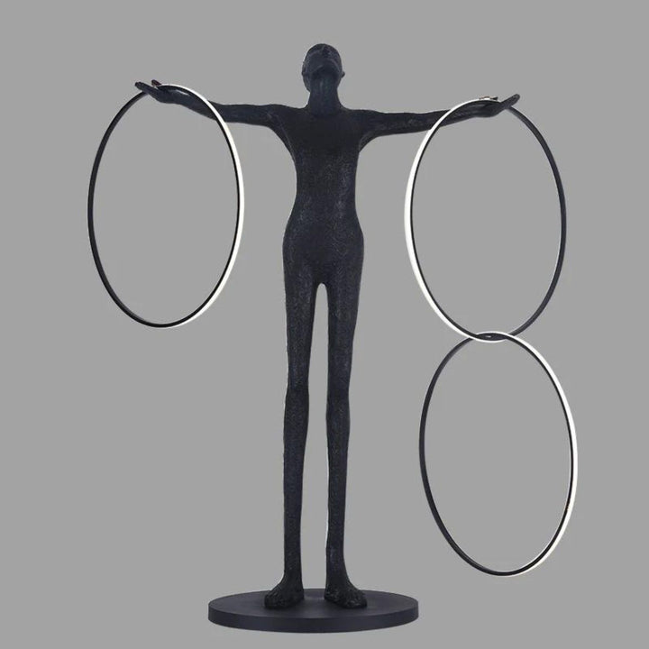 Human figure posing next to a burning circle LED floor lamp, showcasing modern minimalist design and ambient lighting effect