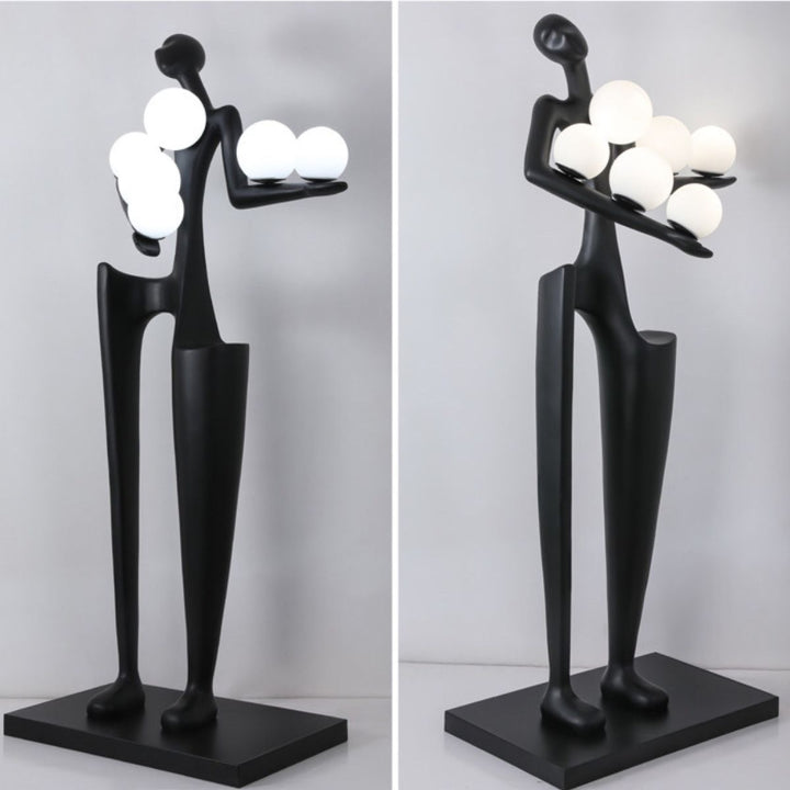 HTA027 sculpture floor lamp featuring a figure holding a light, combining artistic design with functional ambient lighting