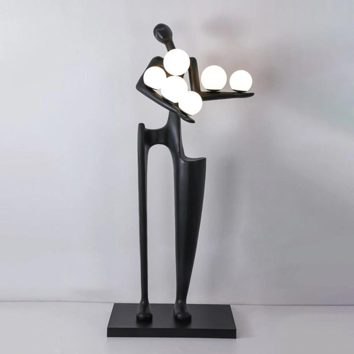 Dreamer black statue sculpture holding multiple glass globes, blending artistic design with modern ambient lighting
