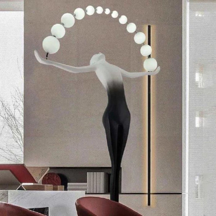 HTA050 floor lamp with woman holding lamps sculpture in Australian living room, blending art and lighting