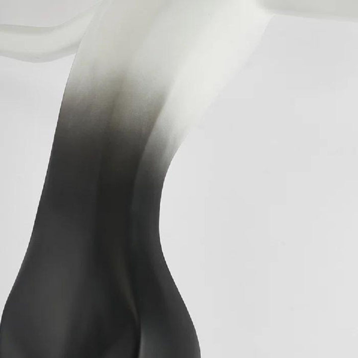 Back side view of HTA050 floor lamp featuring woman holding lamps sculpture in Australian interior