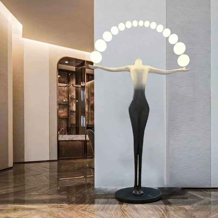 HTA050 floor lamp with woman holding lamps sculpture placed on entry side wall in Australian interior