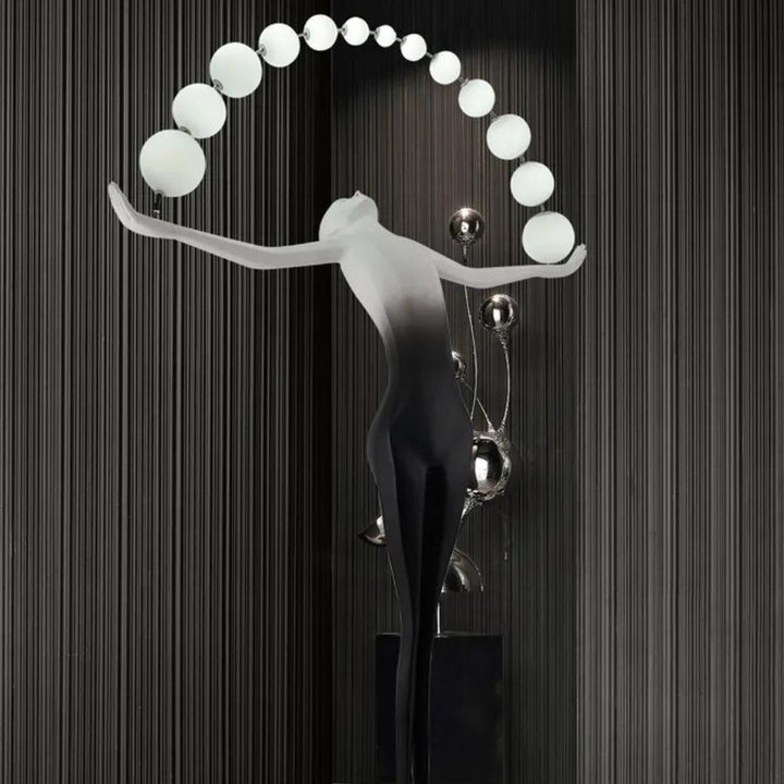 HTA050 artistic floor lamp of woman holding lamps sculpture, showcased in a modern Australian interior