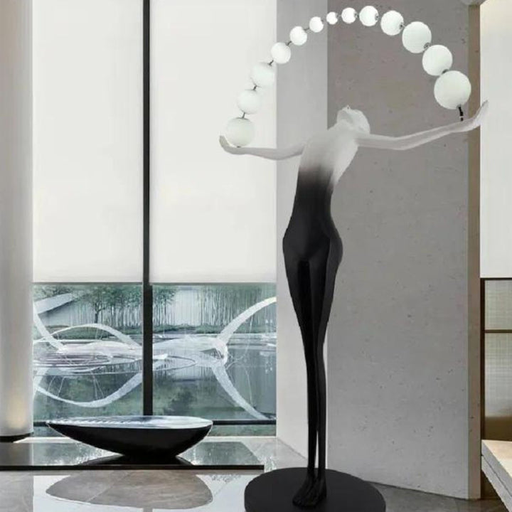 HTA050 floor lamp featuring a woman holding lamps sculpture, displayed in a contemporary Australian interior