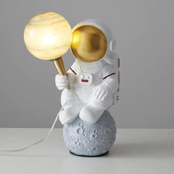 HTQ007 sitting astronaut table lamp with futuristic design, perfect for modern and space-themed rooms