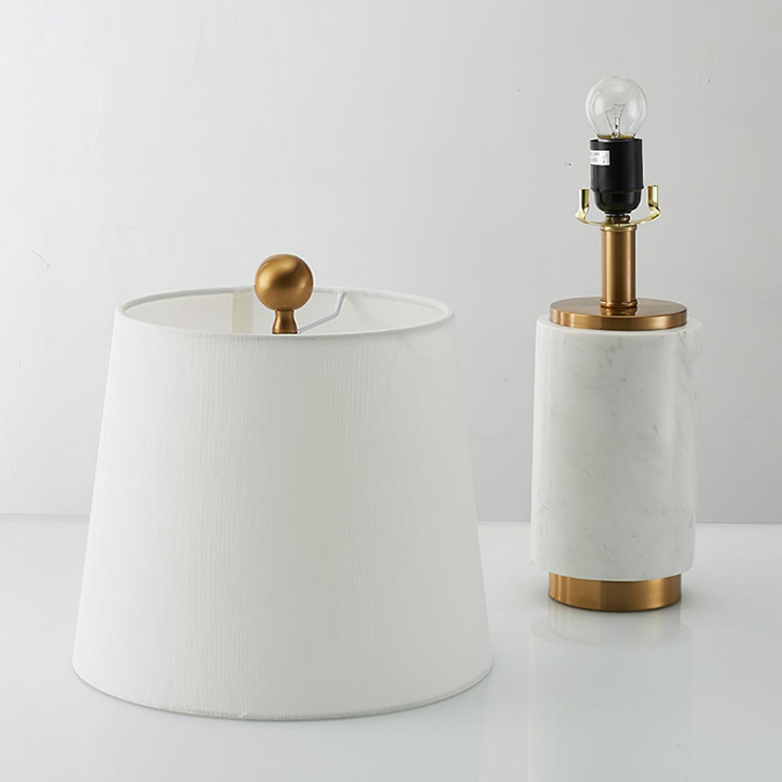 Close-up of Joana marble-based table lamp with open head showing light source