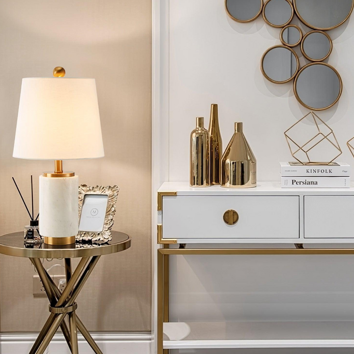 Joana marble-based table lamp placed on wooden table in modern room