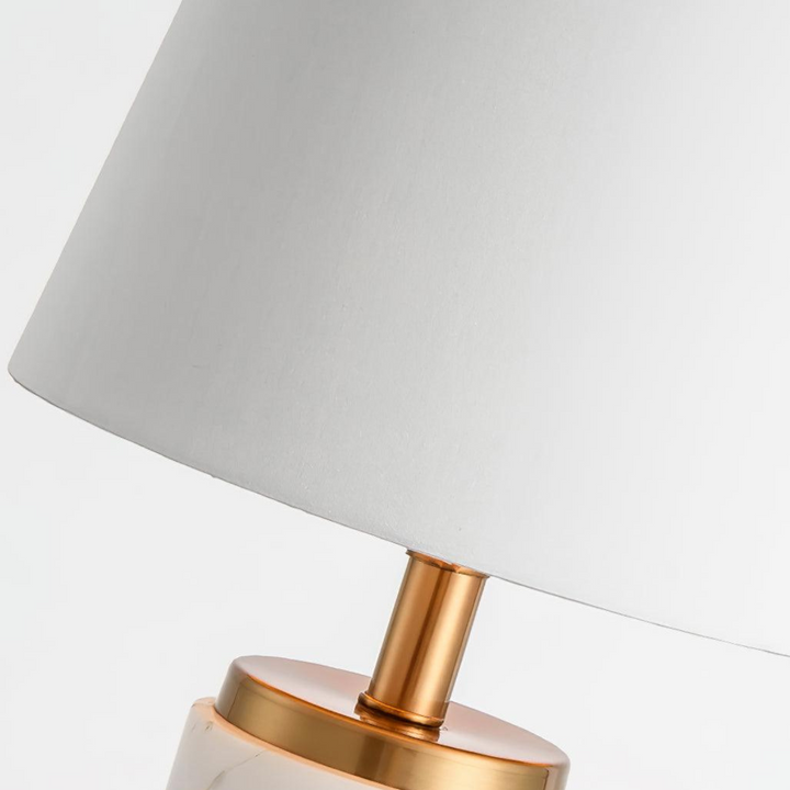 Close-up view of Joana marble-based table lamp light showing warm glow
