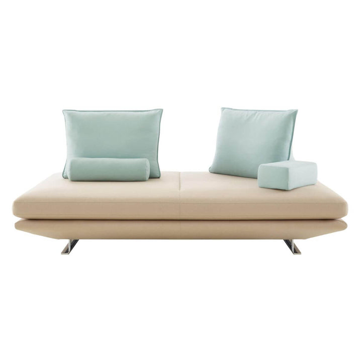 Front view of KS135 Eclipse no-backrest fabric sofa, showcasing its minimalist silhouette and soft upholstered seating for modern interiors