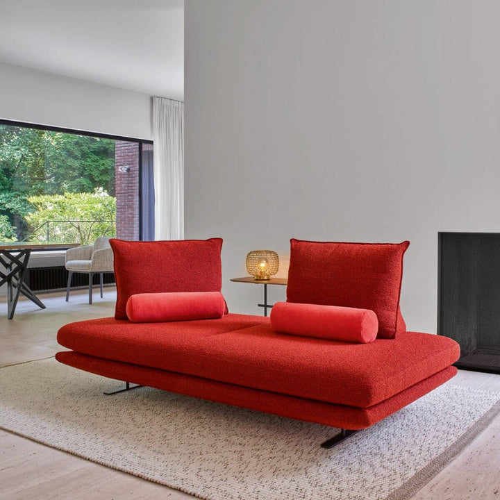 Side view of KS135 Eclipse red no-backrest fabric sofa, highlighting its sleek minimalist design and soft textured upholstery for modern interiors
