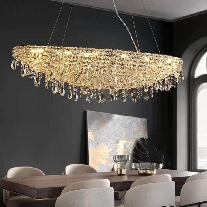 Zodiac crystal chandelier light hanging over dining table, creating a stylish and elegant atmosphere